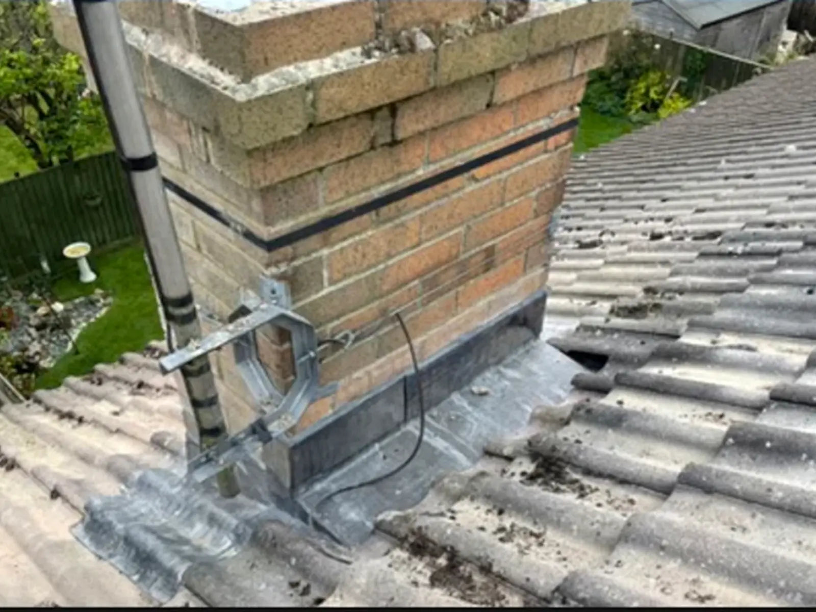 Chimney base, leadwork and roof covering