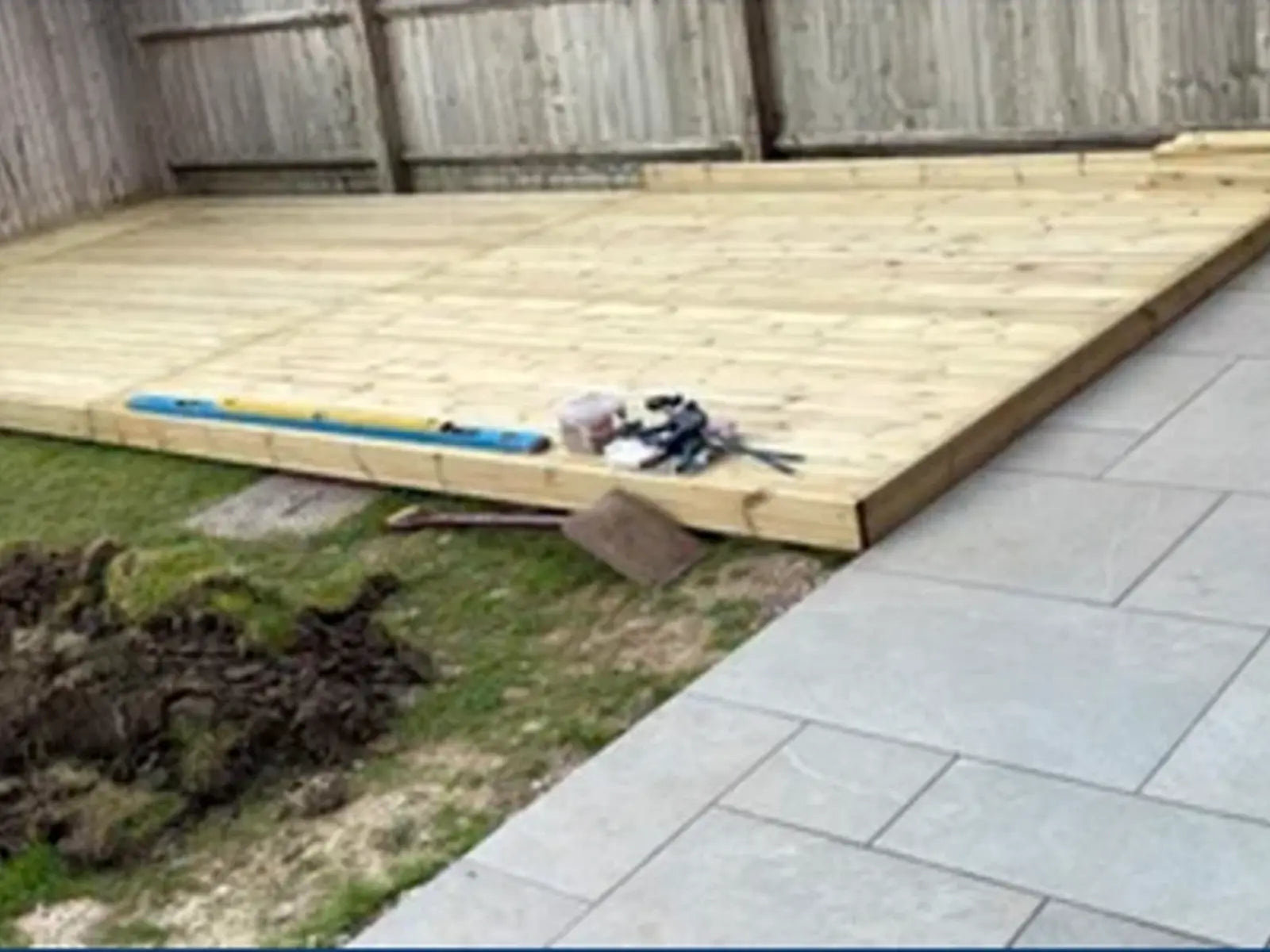 New timber deck beside paving