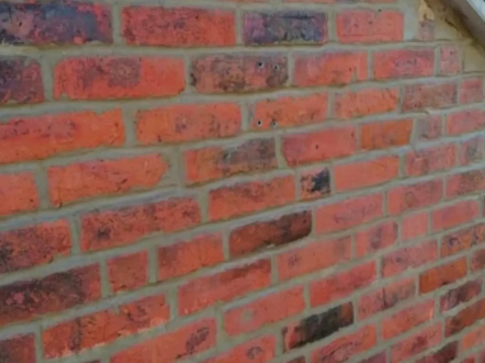 Close crop of renewed brickwork joints