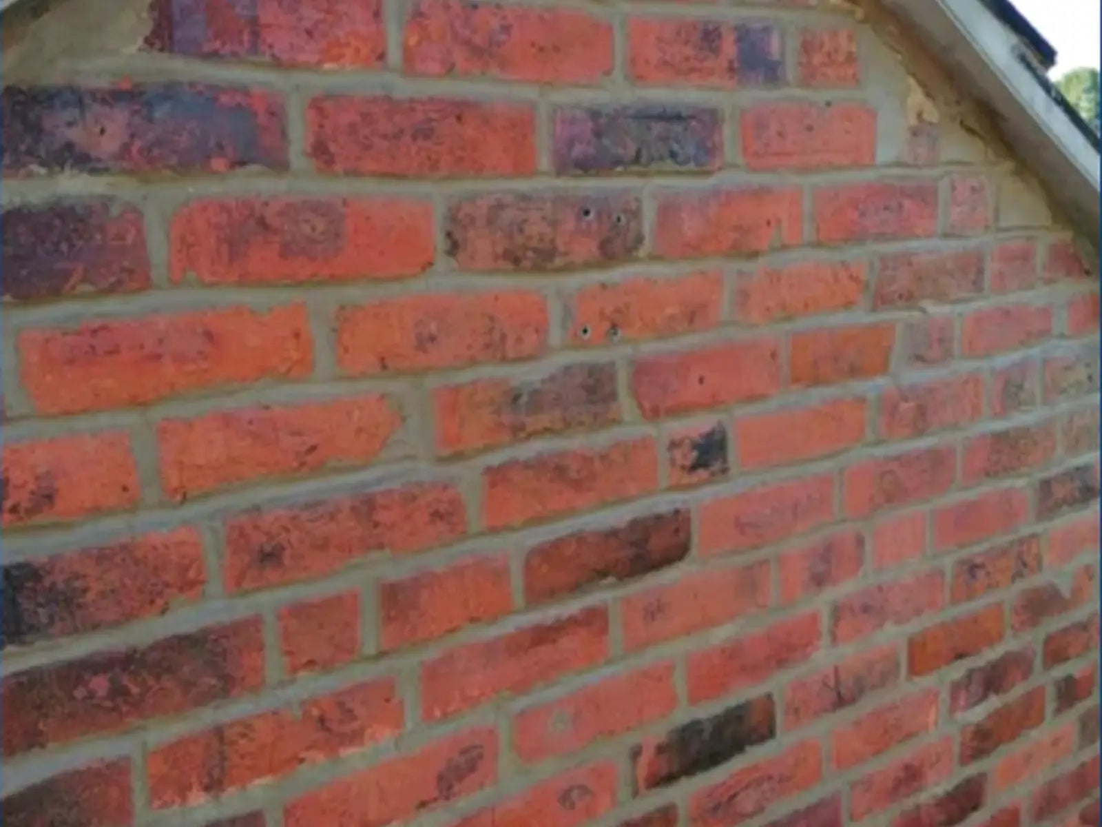 Close view of repointed brick wall with renewed joints