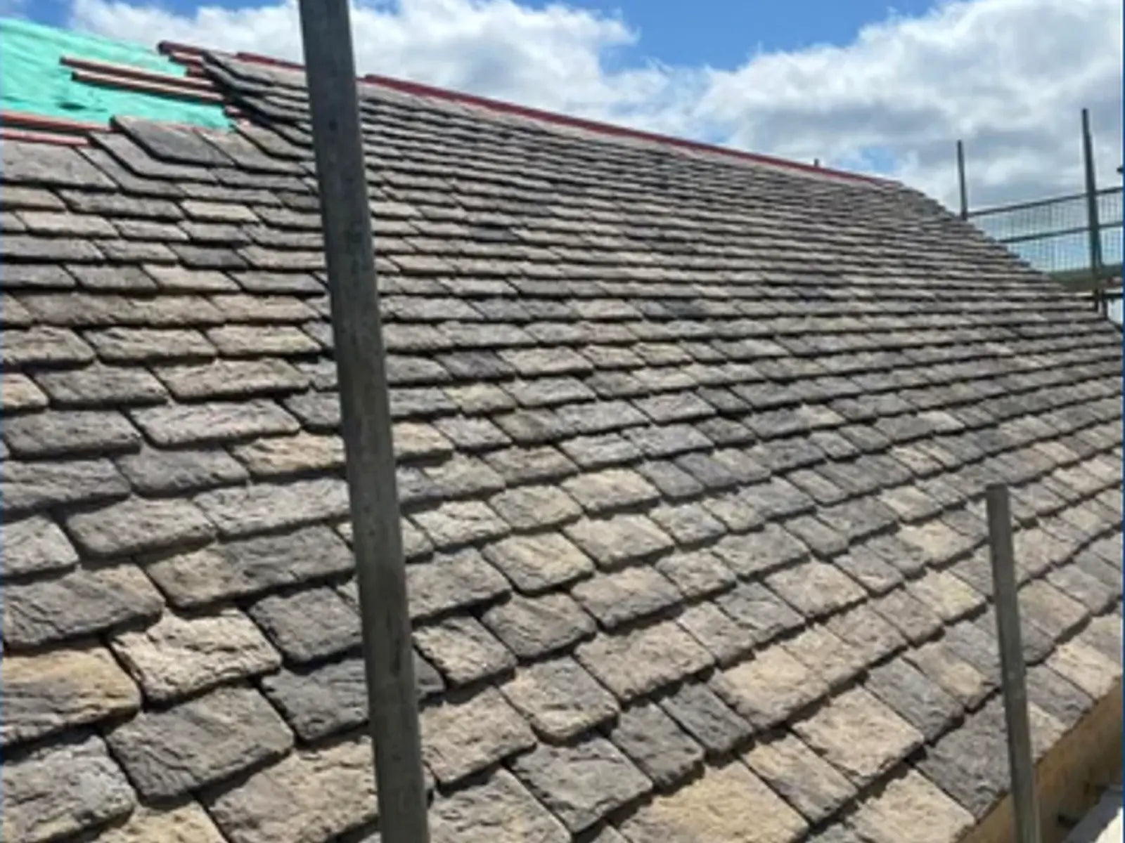 Traditional stone tiled roof under construction